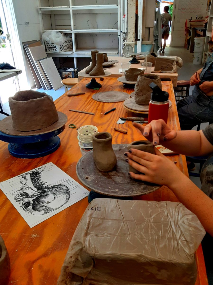 Pottery students are making feet out of clay