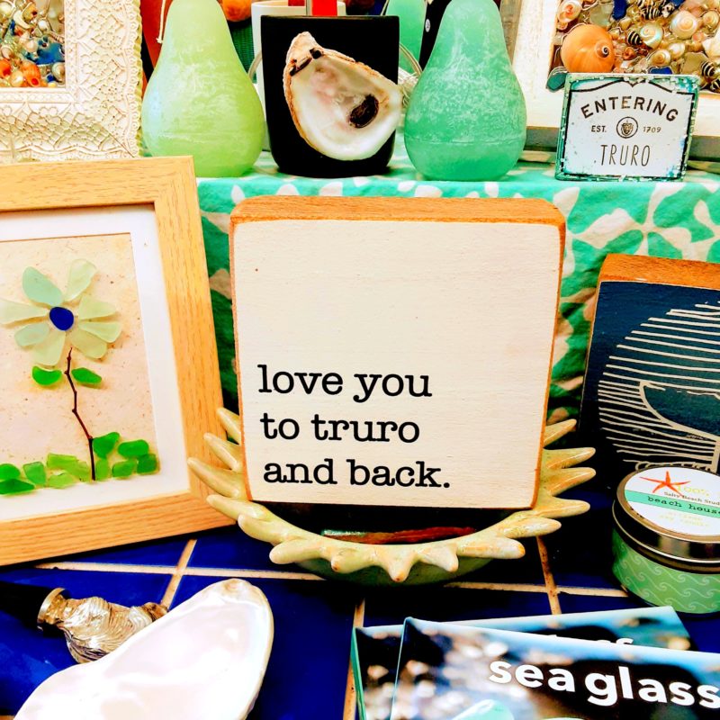 A sign reads "love you to Truro and back"