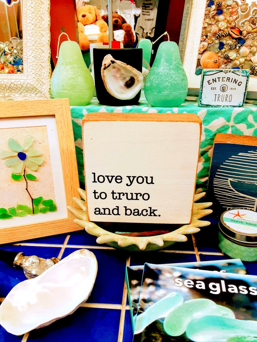 A sign reads "love you to Truro and back"
