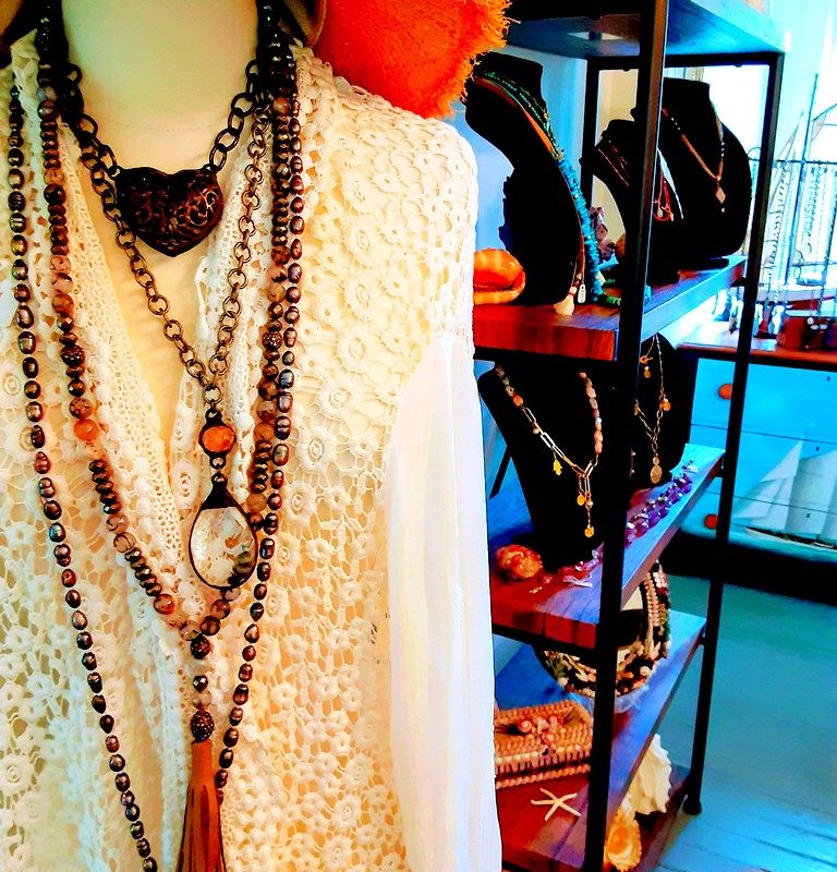 jewelry and sweaters are displayed for sale